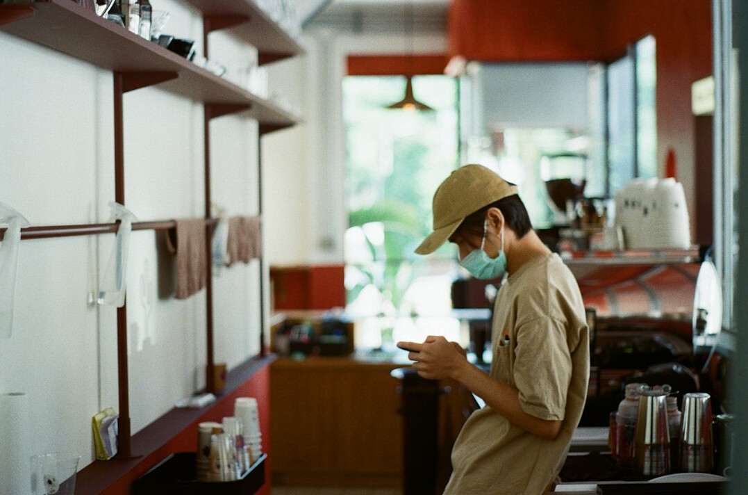 Journalist reviewing printed documents and files at a desk